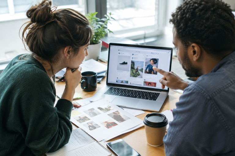 Small business owner reviewing a Facebook ad testing comparison on a laptop